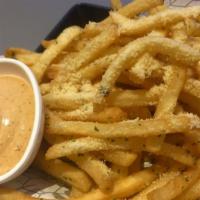 Roasted Garlic Fries · Our golden, crispy fries smothered in roasted garlic.