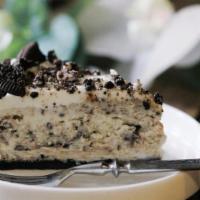 Oreo Cheesecake · Decadent, creamy, NY-style cheesecake marbled with crumbled bits of Oreo cookies.