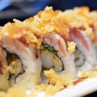 Crunchy P&K Roll · Shrimp tempura, cucumber
top with Hamachi, white tuna,
crunchy, jalapenos, spicy
cream and m...