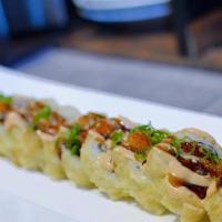 Crunchy CA Roll · Deep fried CA roll with eel
sauce, spicy cream sauce,
tobiko and sesame