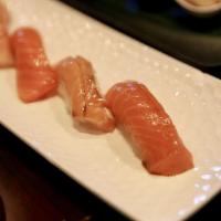 Salmon Tasting · Four pc nigiri of salmon, salmon belly, king salmon and smoke salmon.
