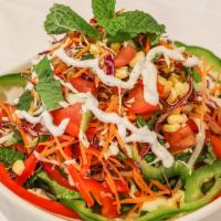 8. Rainbow Salad · Gluten-free. Org. lettuce, cucumber, tomato, yellow corn, cabbage, org.tofu, carrot, red and...