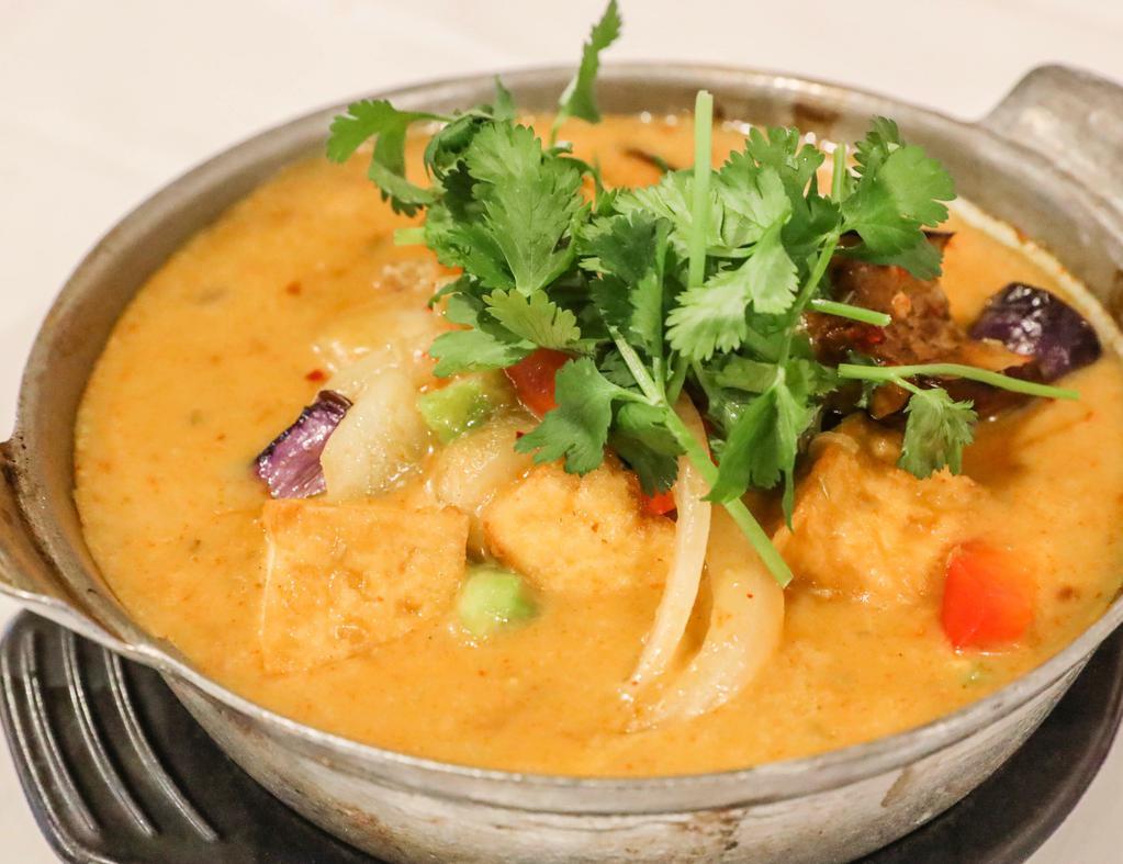 44. Eggplant Curry · Gluten-free, onion and garlic. Organic tofu, eggplant, onion, and bell pepper in coconut curry sauce.