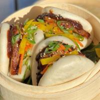 Sticky Pork Bao Buns (3pc) · marinated roasted pork belly, pickled vegetables, micro-cilantro, black bean & hoisin