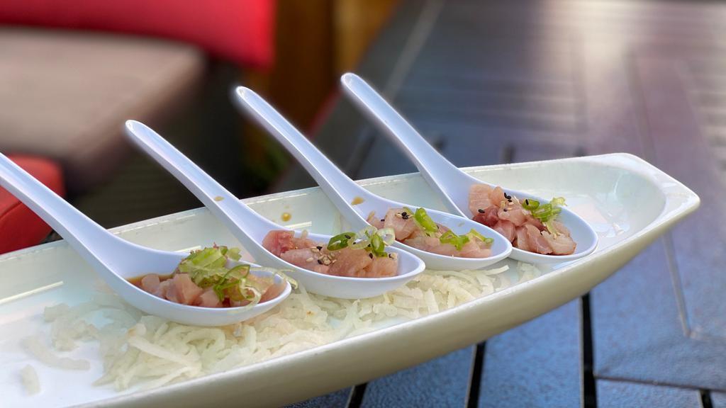 **Hamachi Spoons (4 Pcs) · Hamachi spoons served with ponzu sauce, green onions and sesame seeds.
