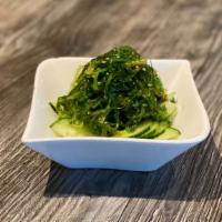Cucumber & Seaweed (Wakame) Salad · Thinly sliced, marinated cucumber topped with seaweed salad.