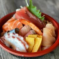 **Chirashi Sushi · Seasoned sushi rice topped with assorted sashimi.