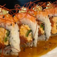 **Under the Sea · spicy crab, spicy tuna, cucumber, wrapped with salmon, topped with cilantro-avocado-wasabi s...