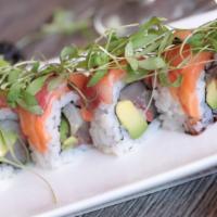 **The Trench Coat · Yellowtail, avocado, wrapped with salmon and yellowtail, topped with micro-cilantro, Persian...