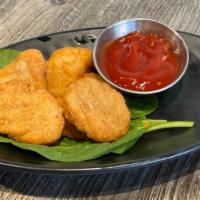 Chicken Nuggets (5pc) · Kids size chicken nuggets served with ketchup