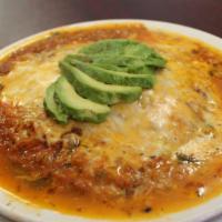 Huevos Rancheros · Tortillas, potatoes, refried beans, salsa, cheese, bacon, avocado, and cilantro.