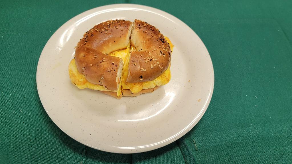 Bagels  Eggs And Cheese · Toasted bagel eggs and jack and cheddar cheese.