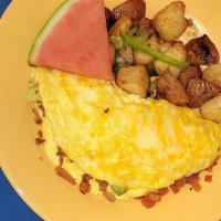 Bacon Omelet · Avocado, bacon, tomatoes, green onions and monterey jack cheese served with house potatoes o...