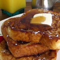 Original French Toast · Original french toast and butter served with syrup.