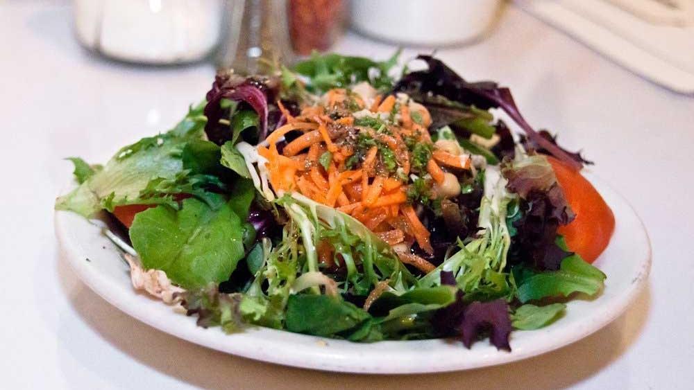 Dinner Salad · Vegan, Gluten-free. Mixed greens with shredded carrots, garbanzo beans, tomato, garlic in house-made vinaigrette