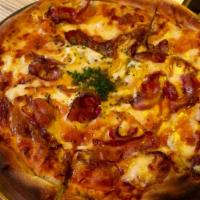 Carbonara · White pizza with bacon, caramelized onions, Parmesan and egg