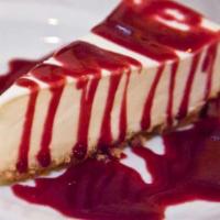 Cheesecake · with home-made raspberry sauce