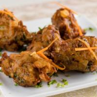 #7. Mixed Vegetable Pakora · Vegetable pieces dipped in batter and deep-fried.
