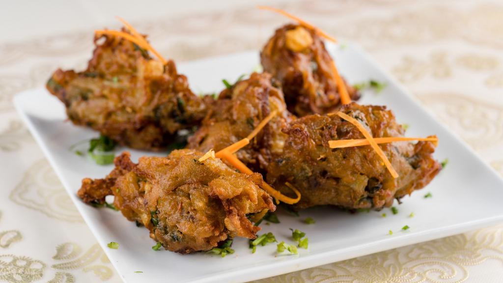 #7. Mixed Vegetable Pakora · Vegetable pieces dipped in batter and deep-fried.