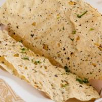 Papadum · Two delicious Indian wafers, mildly spiced.