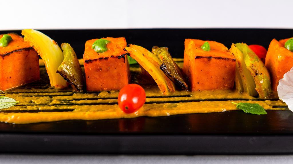 #34. Paneer Tikka · Homemade cheese with fresh ginger, garlic and Indian spices with fresh herbs.
