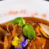 Rogan Josh · Bone in Goat cooked with kashmiri spices in thick gravy.