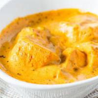 #56. Chicken Tikka Masala · Cubes of chicken tikka tandoori style in a rich cream sauce and cashew.