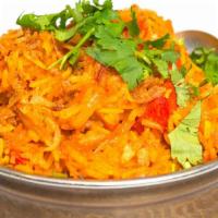 #76. Chicken Biryani · Saffron flavored basmatic rice with spiced chicken, raisins and nuts.