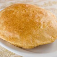 #24. Poori (2 Pcs) · Deep-fried whole wheat bread.