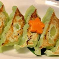 Green Gyoza · Dumplings filled with edamame, onion, and tofu served with sesame sauce