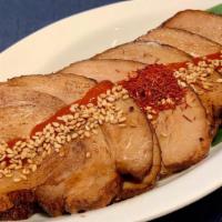 Aburi Chashu · Flame-torched pork belly with sesame and sriracha.<br />—flavorful and fragrant.