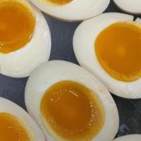 Egg (Ajitsuke Tamago) · Two halves of a marinated soft-boiled egg.