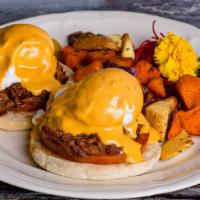 Spicy Pork Benedict · Grilled tomato w/ spicy pulled pork and roasted jalapeno hollandaise sauce.