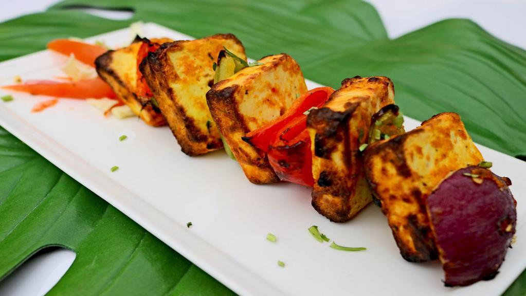 Paneer Tikka · House made indian cheese marinated in yogurt with special herbs & mild spices.