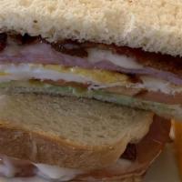 Breakfast Sandwich · choice of ham or turkey, jack cheese, bacon, fried egg, tomato, and avocado with your choice...
