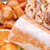 Breakfast Burrito · four eggs, country potatoes, cheddar cheese and a choice of ham, bacon, sausage, or chorizo
...