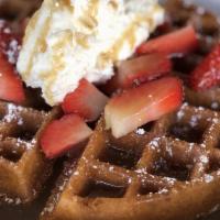 Churro Waffle · buttermilk waffle churro-style topped with homemade whipped cream, strawberries and caramel ...