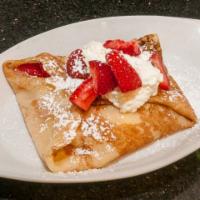 Strawberry Crepe · Strawberries and homemade custard, topped with house whipped cream.