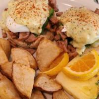 Chicken Apple Sausage Benedict · chicken apple sausage, avocado and poached eggs on an English muffin topped with a pesto-hol...