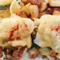 Fried Chicken Benedict · breaded boneless chicken, avocado and poached eggs on an English muffin topped with hollanda...