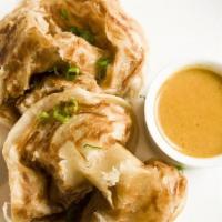 Roti Prata · Traditional Indian Flat Bread, Scallion, House Yellow Curry Dipping Sauce