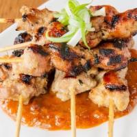 Singapore Satay Sticks · Grilled Chicken Skewers, Spicy Peanut Sauce, Scallions