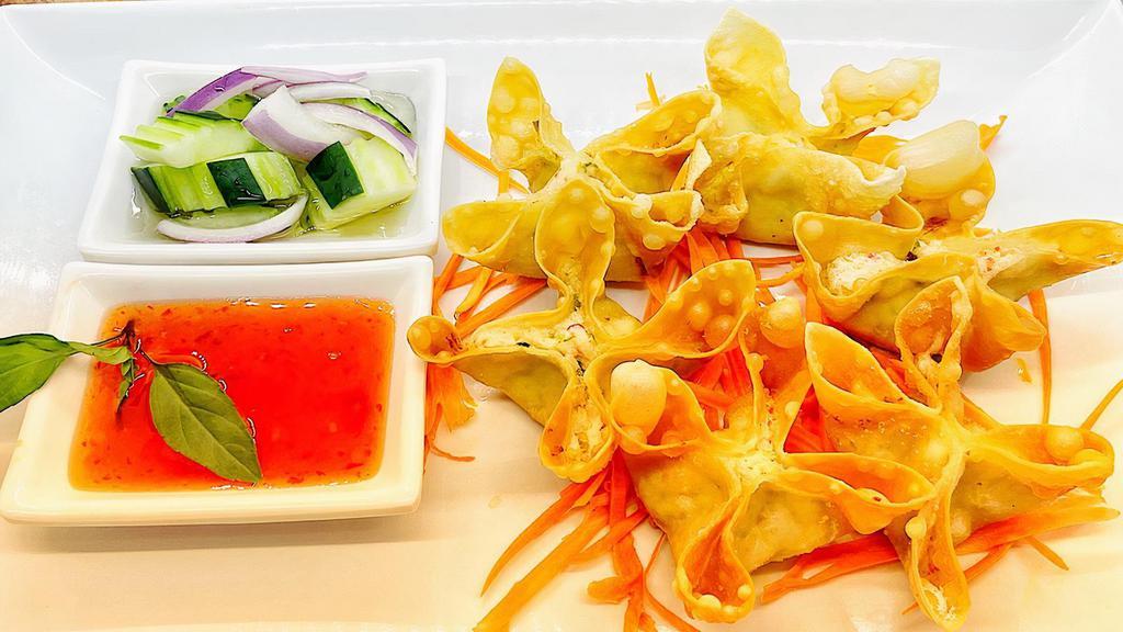 Crab Rangoon · Crabmeat, imitation crab, onion, cream cheese, and celery stuffed in a crispy wonton, served with homemade sauce.