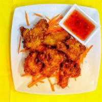 Crispy Wings · Deep-fried chicken wings, served with sweet and sour sauce.