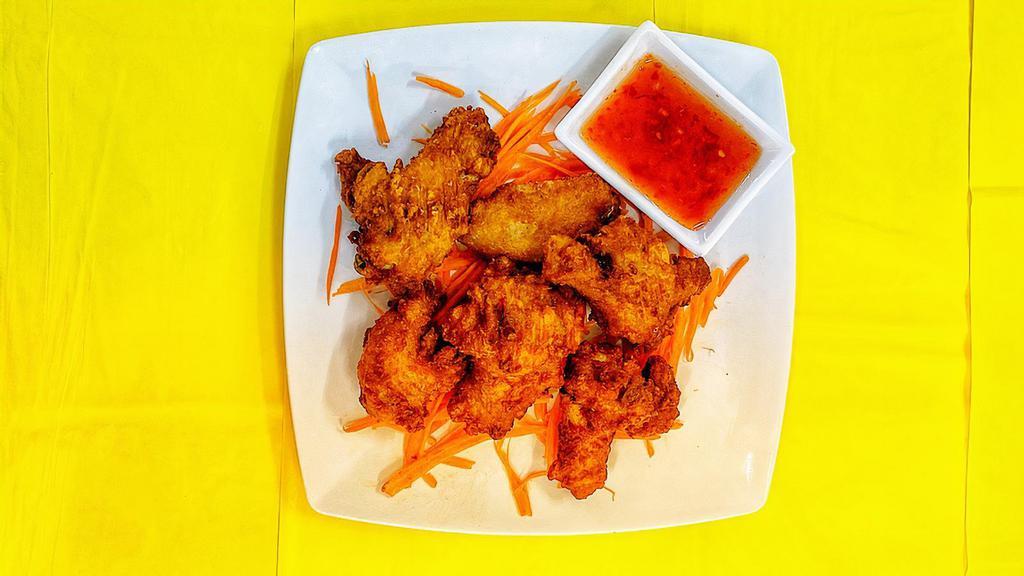 Crispy Wings · Deep-fried chicken wings, served with sweet and sour sauce.