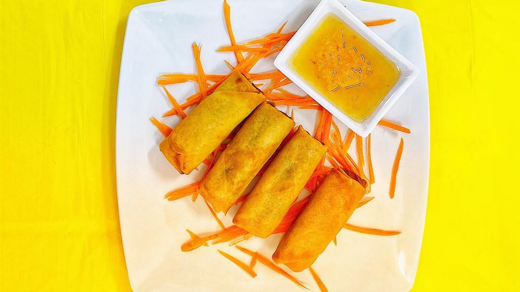 Crispy Veggie Roll · Deep-fried mixed vegetables, wrapped with egg rolls. Served with pineapple sauce.