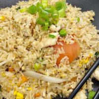 Thai Fried Rice · Thai fried rice with choice of your protein, peas, carrots ,yellow onions, tomato, green oni...