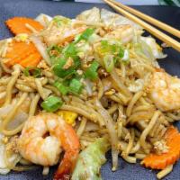 Garlic Noodle · Stir-fried egg noodles with cabbage, white onions, carrots,  green onions, and topped with c...
