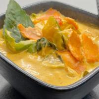 Pumpkin Curry W/Jasmine Rice · Homemade Thai pumpkin curry with bell peppers, basil leaves, pumpkins, and mixed coconut milk.