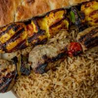 Kabul's Combination Kabab · Best of both worlds; skewer of lamb or beef kabab, and skewer of chicken kabab served with p...